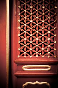 A red painted wood door with gold and brass painted decorations.







A gold and brass painted Chinese door, in red wood.