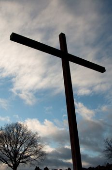 large cross against great cloudy winter sky on Birkenkopf mountain in Stuttgart, Germany