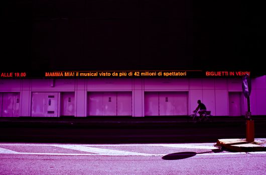 Man in bike on the street in the city of Milan - Italy