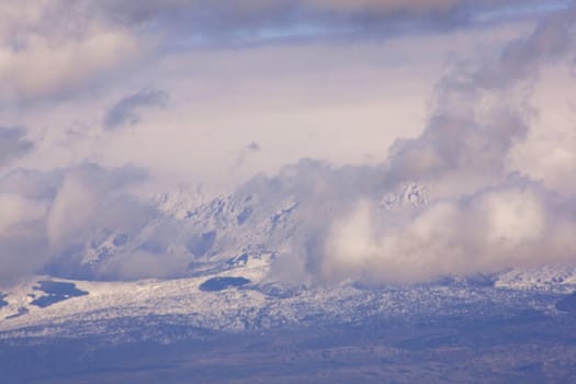 View of Monti Nebrodi with snow and clouds
