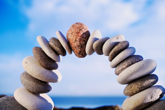 Arc crookedness of the pebbles on the background sky