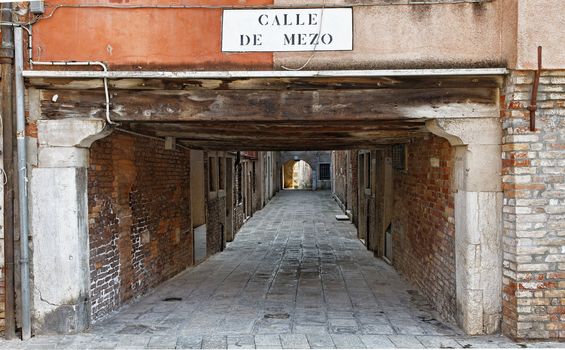 Calle de Mezo- a typic small street passage in Venice,Italy.