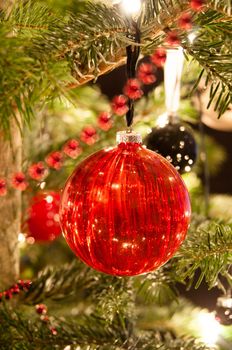 Decorative christmas balls and decoration hanging on pine - tree branch