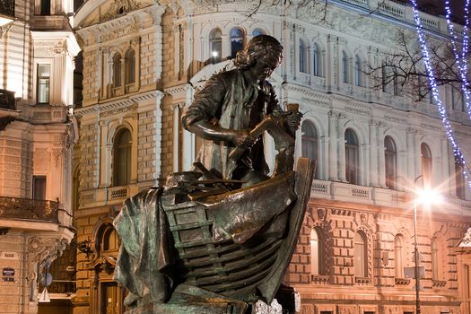 Horizontal view of statue Peter the Great carpenter at night, St. Petersburg, Russia