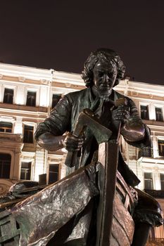 Bronze statue Peter the Great carpenter at night, St. Petersburg, Russia