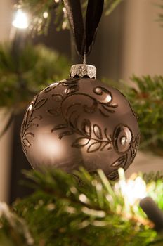 Decorative christmas balls and decoration hanging on pine - tree branch