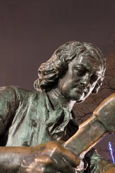Part of bronze statue Peter the Great carpenter at night, St. Petersburg, Russia