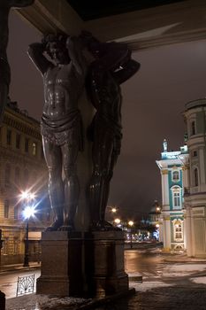 Night view of Granite Atlases Guarding the Hermitage in St. Petersburg, Russia