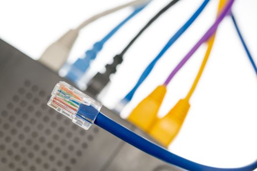 Close macro focus on internet lan cat5 cables as concept for cyberwarfare