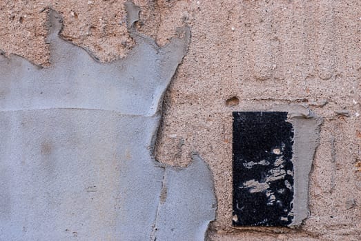 the plastered wall with a ceramic tile