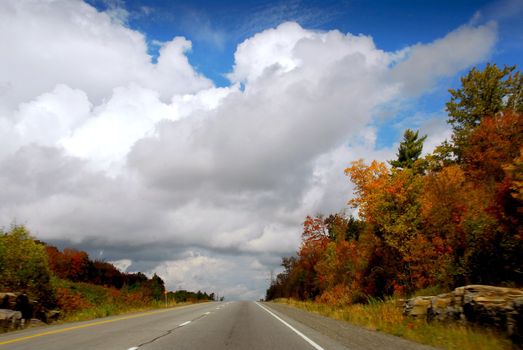 Divided highway in the fall, some motion blur on the sides