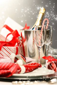 Christmas champagne with gifts against dark silver background