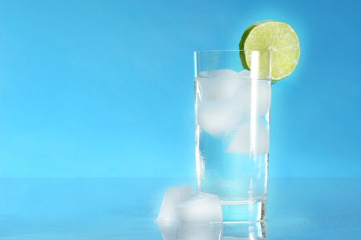 Glass of cold water with ice cubes