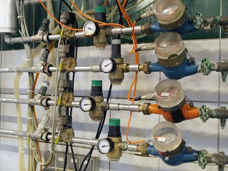 Industrial pipes and measurement meters in a factory
