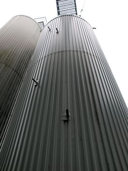 Big metal containers silo in a food plant        