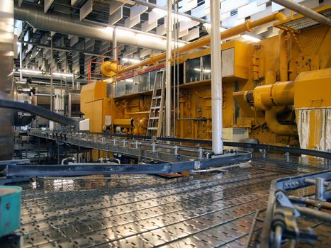 Machinery conveyor belt in a modern factory plant   