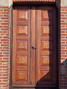 Old decorative wooden door of a church        