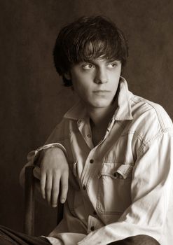 Portrait of the young in studio. b/w+sepia