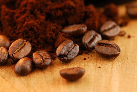 Macro image of coffee beans and ground coffee