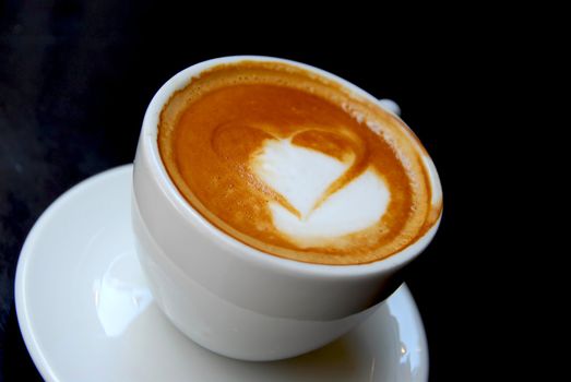 Cappuccino with heart shape on foam