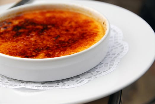 A plate of delicious dessert creme brulee