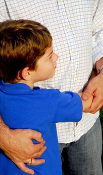 Little boy hugging his father