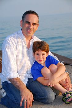 Portrait of a father and son on a pier