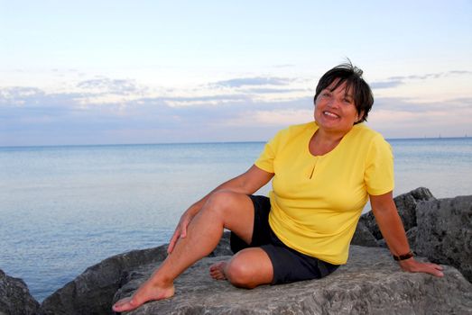 Mature woman relaxing on a shore