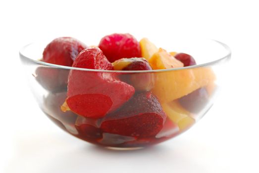 Serving of fruit salad on white background