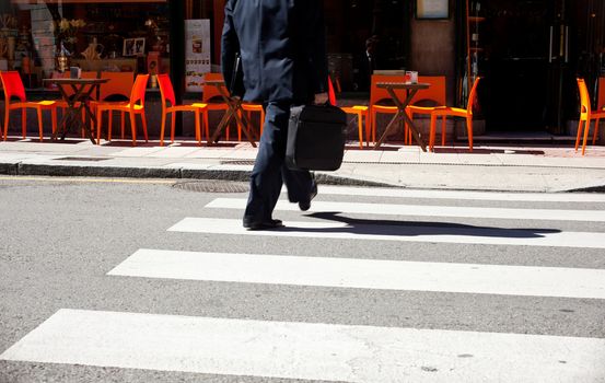 A businessman on the pedestrian crossing