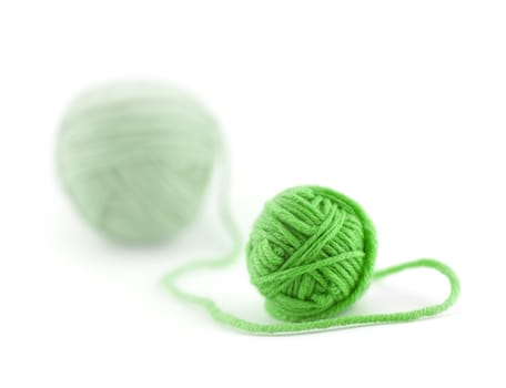 Green thread ball isolated on white background