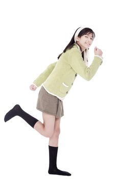 biracial asian girl in green sweater and skort in running position, isolated