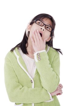 Biracial asian girl in green sweater and glasses looking up, yawning