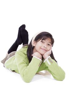 Biracial eleven year old girl lying on floor relaxing