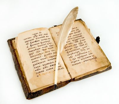 old book with a quill pen