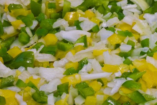 chopped pieces of green & yellow pepper with onion