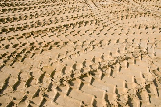 Freight car wheel marks in the sand. Transportation concept background.