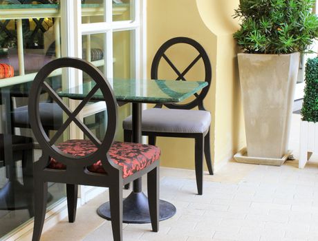 Modern table and chair setting in outdoor restaurant