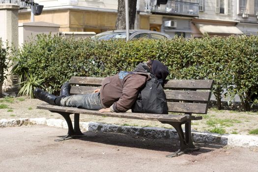Homeless sleeping on the bench