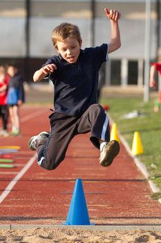 a cute jumping young kid