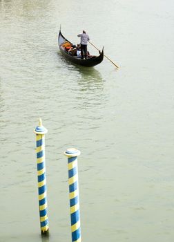 Gondolier in the Venice lagoon , Italy
