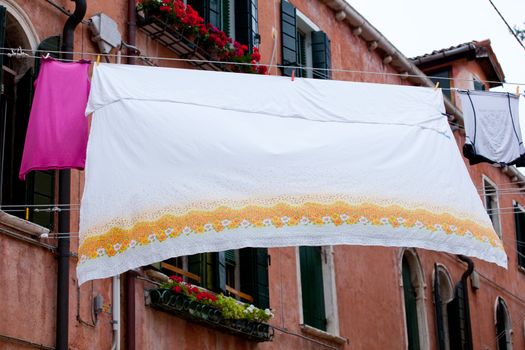White laundry hanging to dry on a clothes-line.