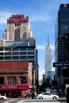 New York City Manhattan 34th street scene with the landmark New Yorker Hotel and Empire State building.