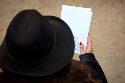 Woman in black read a book