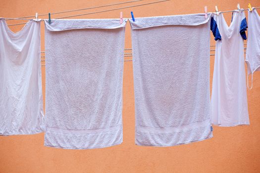 White laundry hanging to dry on a clothes-line.