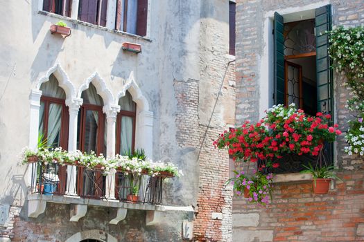 Typical Venetian balcony with flower pots