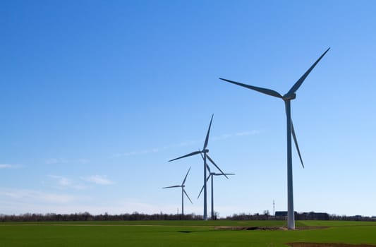 A wind turbine under clear blue sky