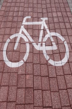 bike sign painted on a brick pavement