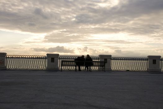 Couples sittting on the bench, Ortigia