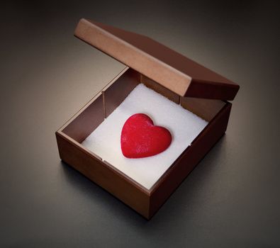 Red heart in a wooden box